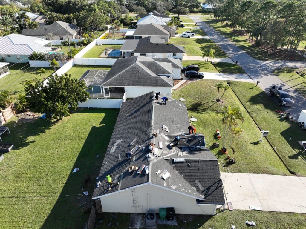 Team installing roofing materials during ongoing residential or commercial roof project.